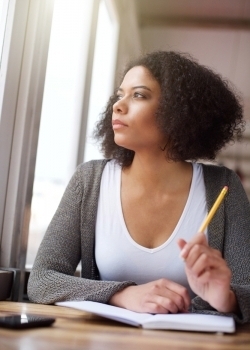 Close up portrait of a young african american woman thinking