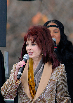 Naomi Judd Speaking during Mental Health Awareness Month at Local Event
