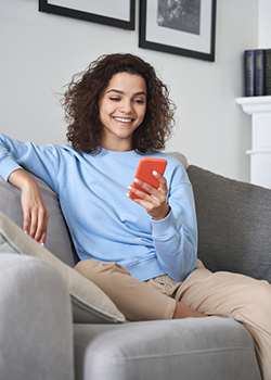 Teen having a happy text conversation with her friend