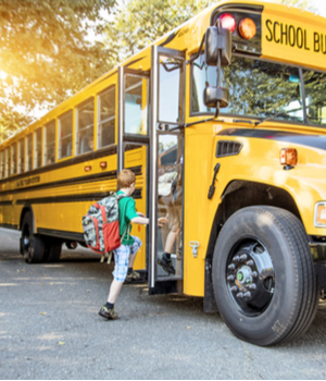 child boarding school bus