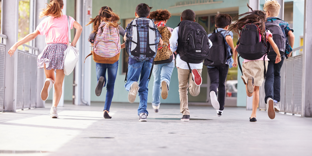 school kids running to recess