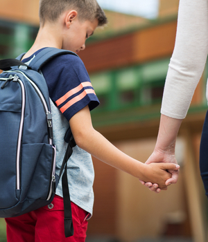 mother walks son to class