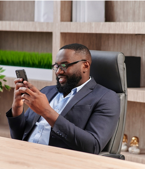 black businessman on smartphone