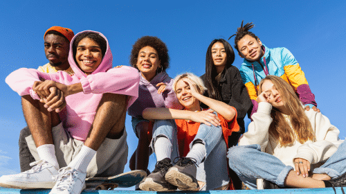 group of african american friends at beach