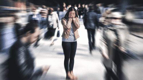 troubled woman in crowd