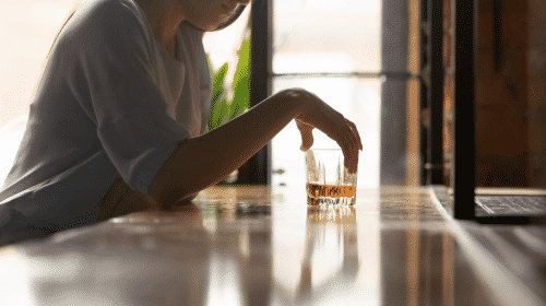 woman drinking glass of alcohol