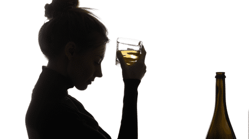 woman with glass of alcohol