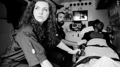 emt helping person in ambulance