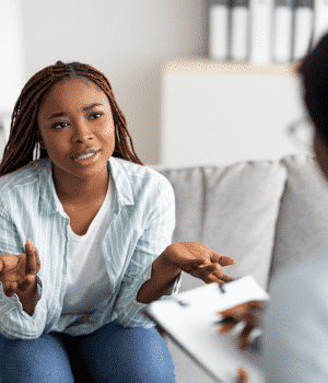 black woman talking to therapist