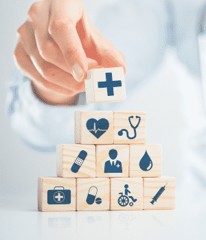 doctor stacking blocks representing medical topics