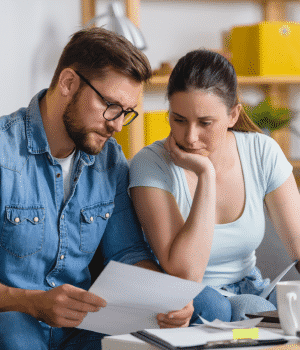 husband and wife looking over finances