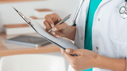 medical personel holding paper work