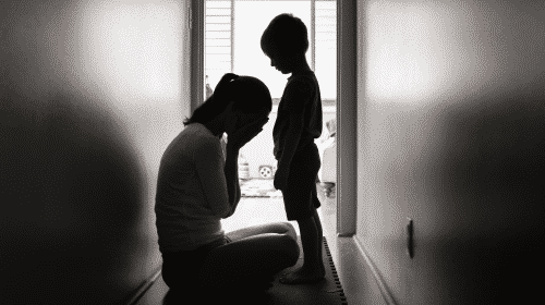 mother and son sad in hallway