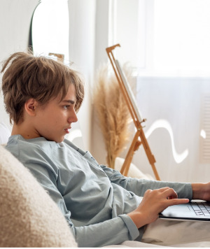 teenager on laptop