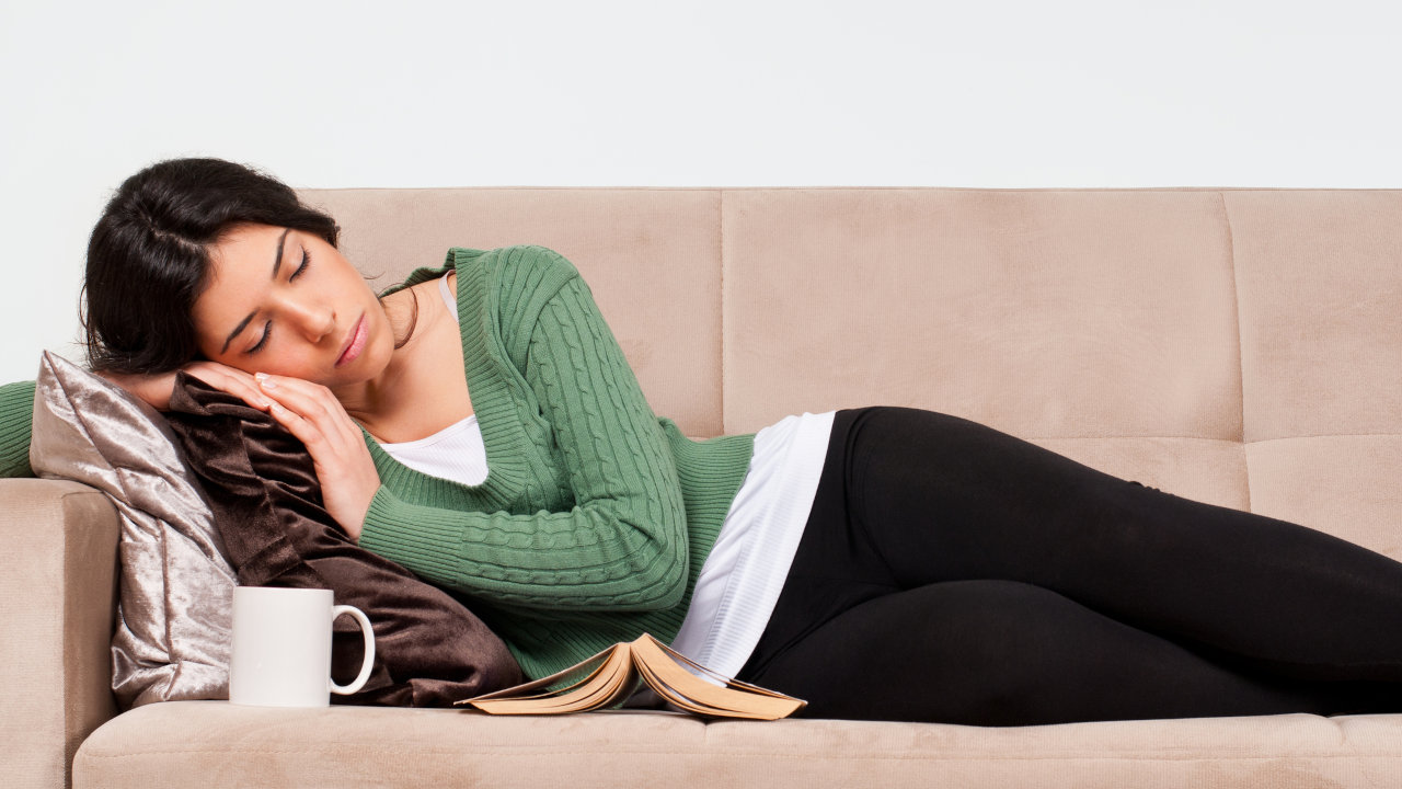 A woman asleep on a couch, possibly due to a barbiturate overdose