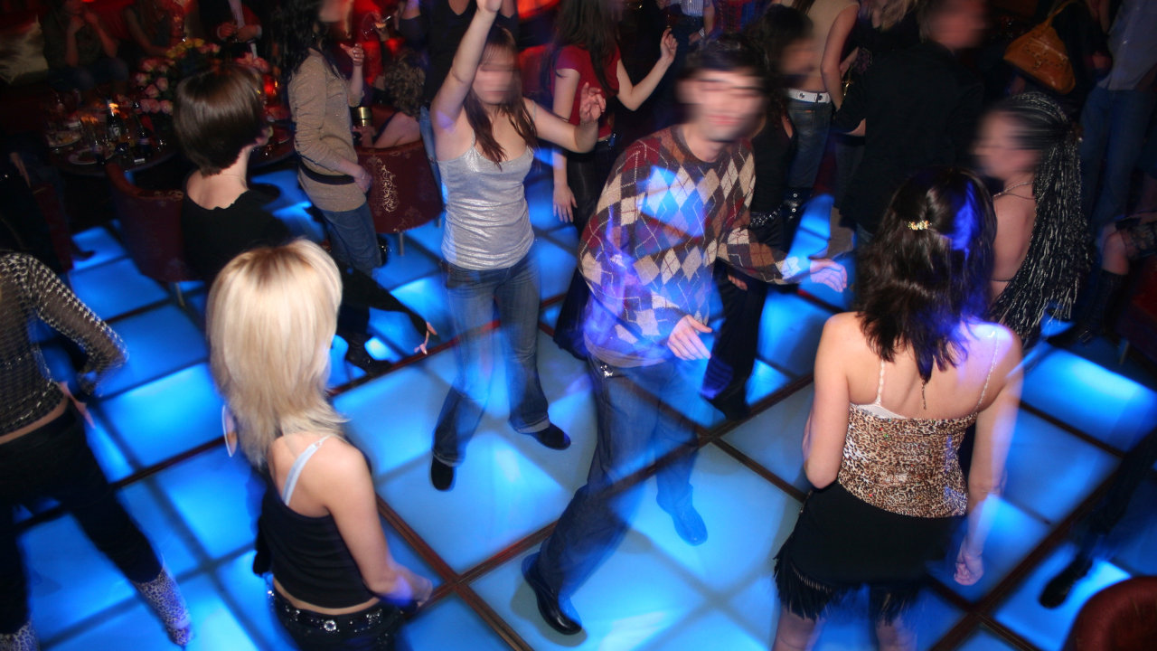 People dancing at a club, where MDMA / ecstasy use is common