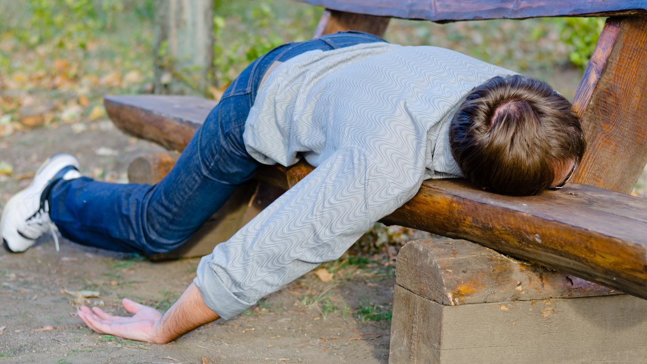A man passed out on a bench, possibly suffering from an oxycodone overdose