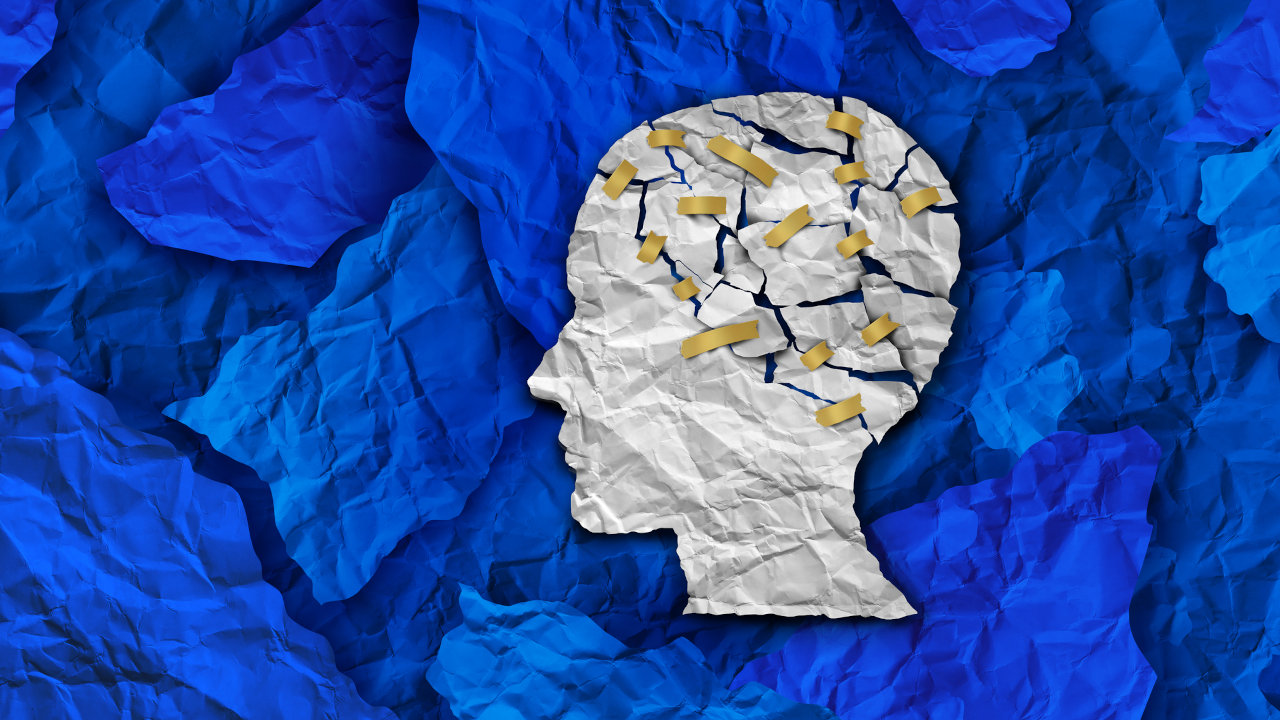 Graphic of a person's head with cracks all over the cranium, suggesting brain damage or trauma