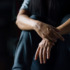 A depressed man against a dark background. Learn more about the link between trauma and addiction here.