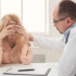 A distressed woman speaking with a doctor. Learn more about common addiction relapse triggers and how to manage them here.