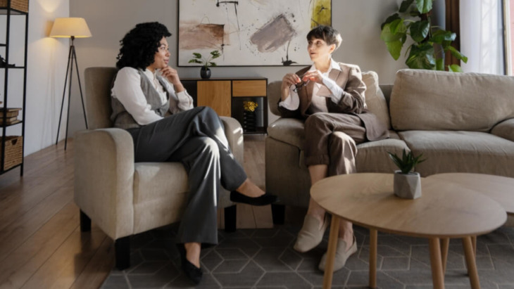 Two people talking to each other in a casual setting