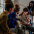 People speaking with someone at a support group. Learn more about how to talk to someone who doesn't think they have a problem or addiction, here.
