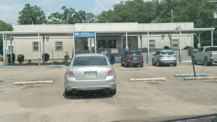 Exterior view of Hammond VA Clinic showing main entrance with Department of Veterans Affairs signage, covered entry area, and visitor parking spaces
