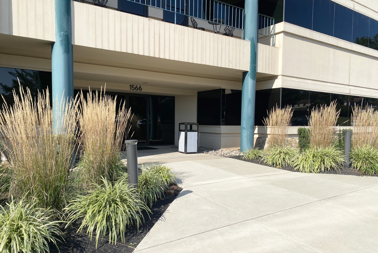 Exterior view of treatment center entrance at 1566 Medical Drive with modern building facade, decorative landscaping, and covered entryway