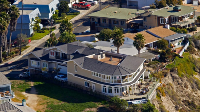 Exterior aerial view showing multi-building treatment facility complex on San Clemente coastline with ocean views and residential surroundings