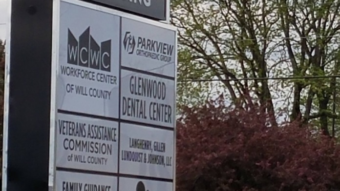 Exterior directory sign listing multiple organizations including Family Guidance Center at Glenwood Building