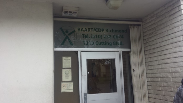 Exterior entrance showing BAART/CDP Richmond sign with contact information and phone number