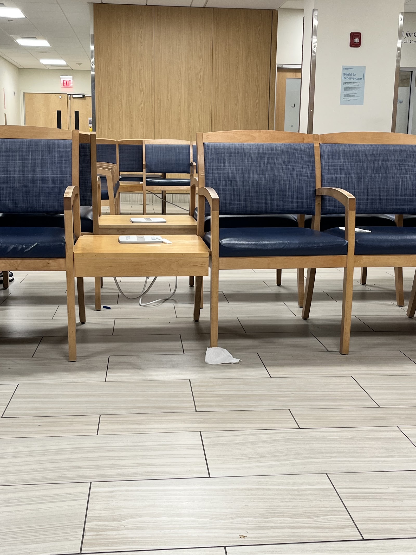Interior clinical workspace with concrete walls, panoramic window view, and medical equipment shelving