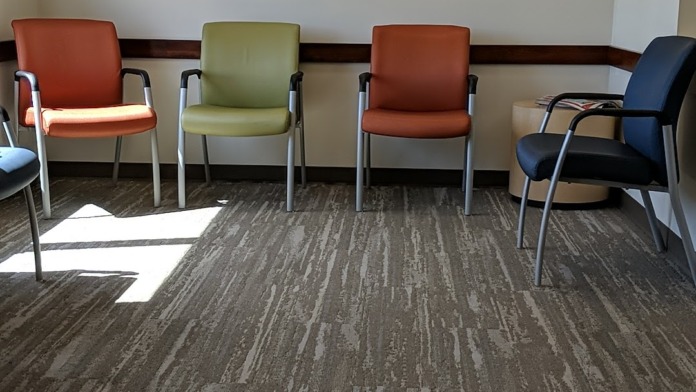 Interior common area with multiple seating options in various colors and calm, welcoming atmosphere