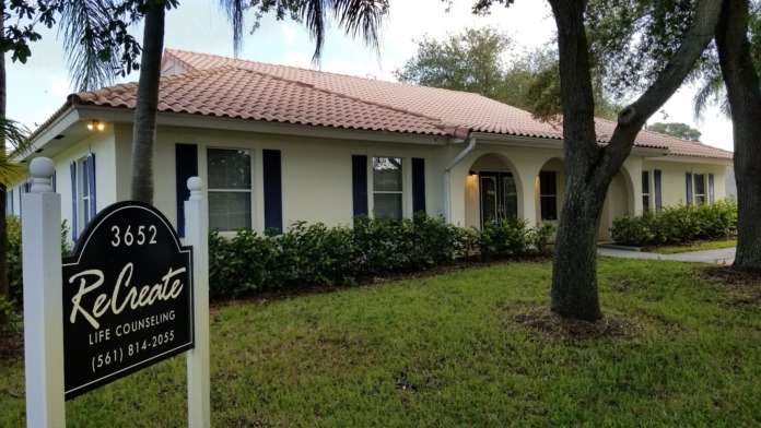 Exterior showing facility signage with address 3652 and Relocate Life Counseling text, white building, landscaping, and mature trees.