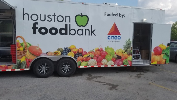 Exterior Houston Foodbank mobile unit with colorful produce graphics and fruit basket design on white trailer