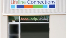 Exterior front entrance showing Lifeline Connections logo sign and mission statement 'hope. help. Healing.' with address 311 displayed