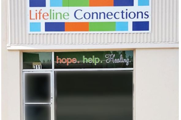 Exterior front entrance showing Lifeline Connections logo sign and mission statement 'hope. help. Healing.' with address 311 displayed