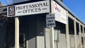 Exterior view of professional offices building entrance at 51 Locust Street with OnCall signage and parking area