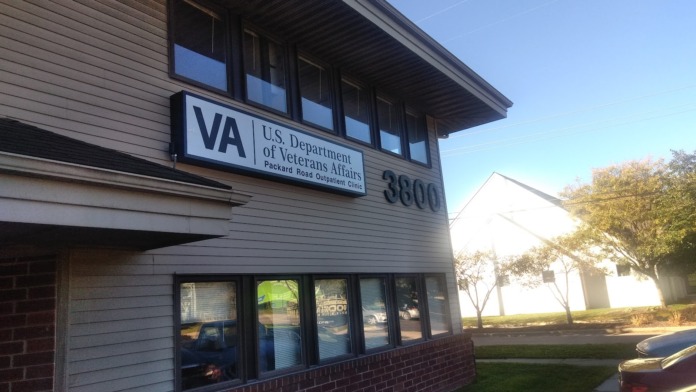 Exterior front entrance showing VA U.S. Department of Veterans Affairs signage and address 3800 on building facade