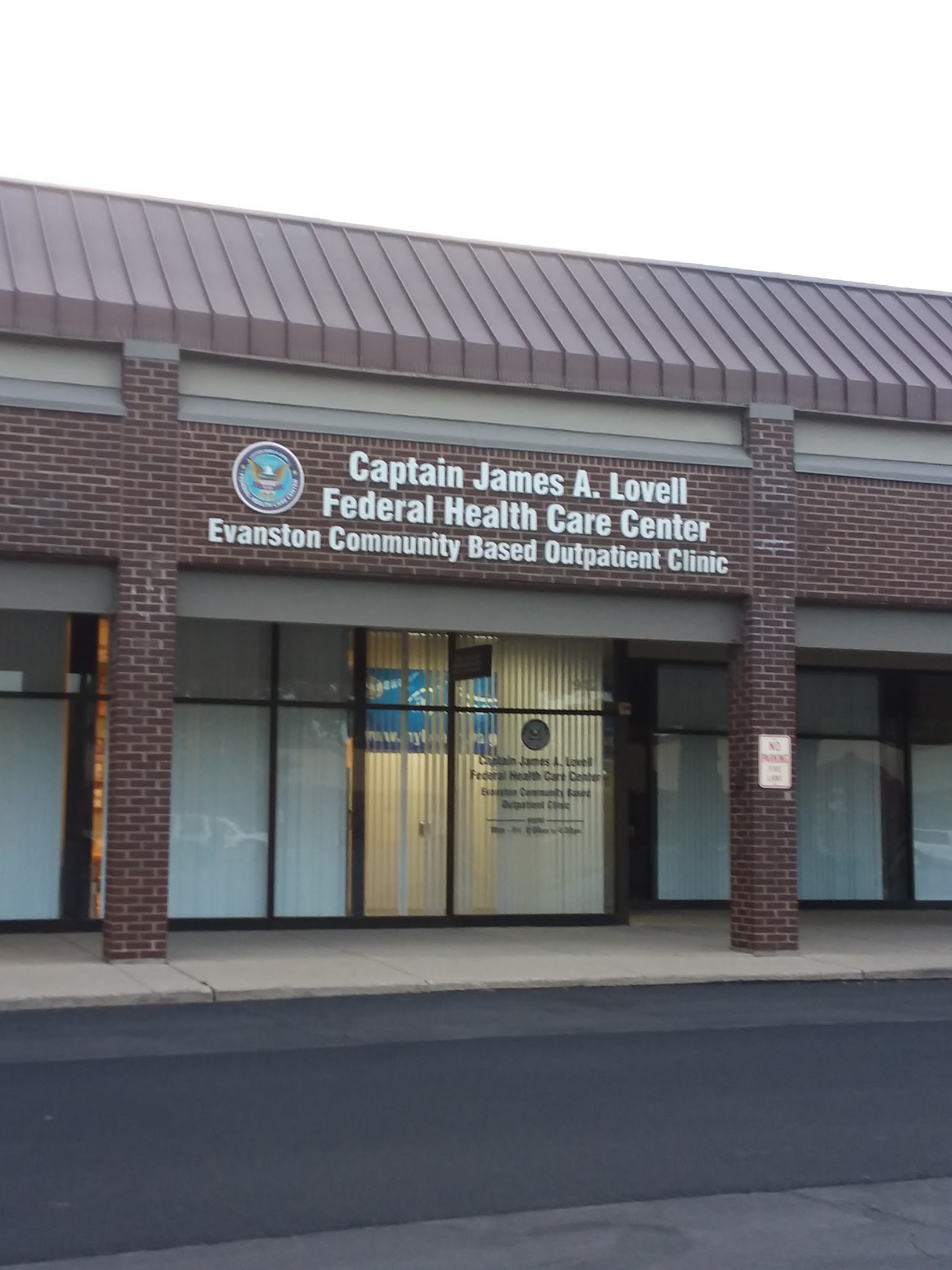 Exterior view of Captain James A. Lovell Federal Health Care Center Evanston CBOC with brick facade, metal roof, and main entrance signage