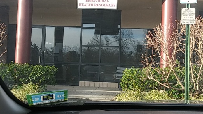 Exterior view of South Jersey Behavioral Health Resources building showing brick facade, entrance with signage, and accessible parking