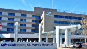 Exterior view of SSM Health St. Mary's Hospital main entrance with modern architecture, columned portico, and landscaping