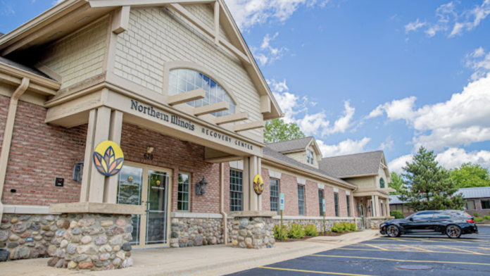Exterior view of Northern Illinois Recovery Center brick building with main entrance, stone accents, and facility signage
