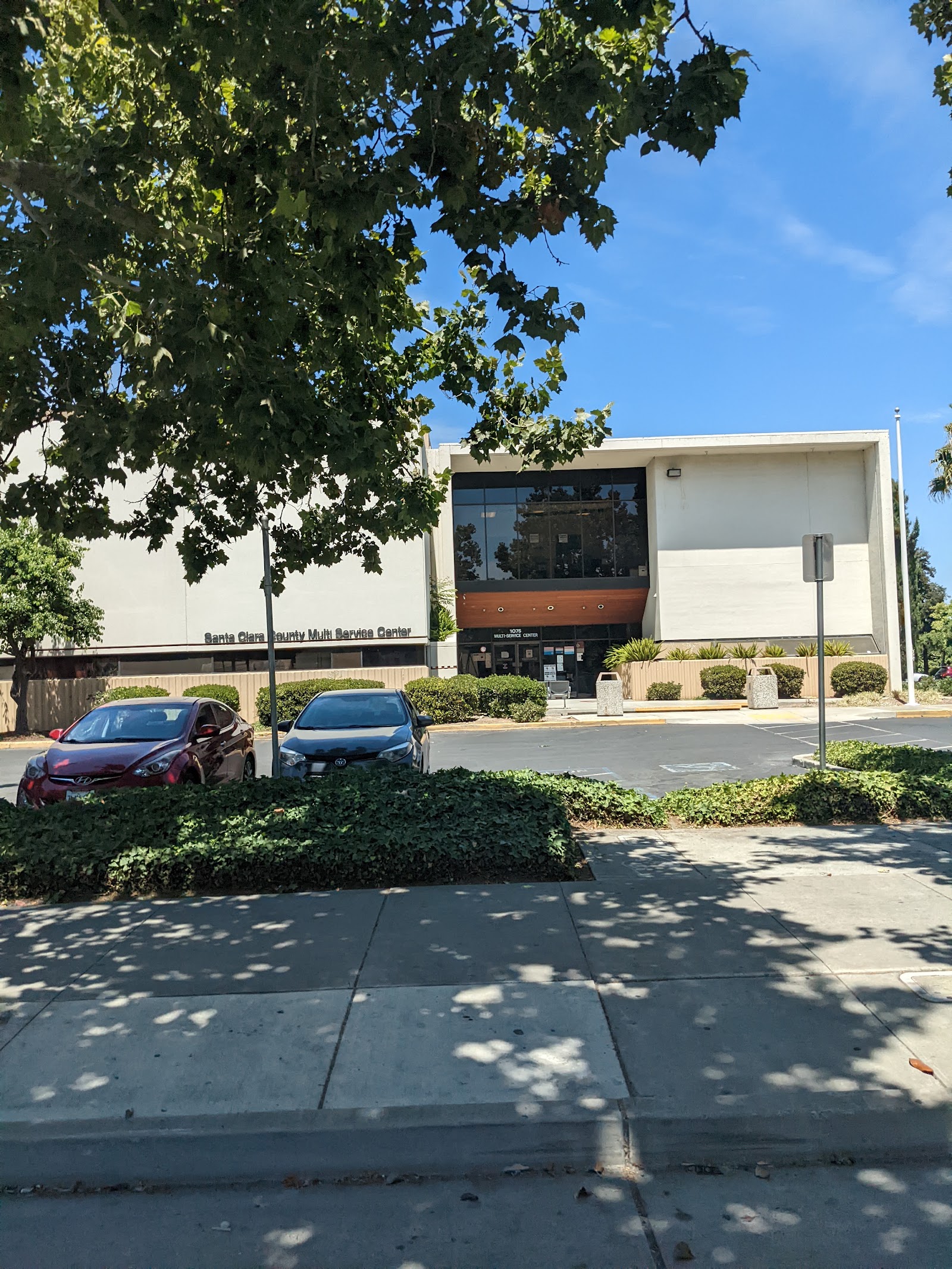 Exterior view of Santa Clara County Multi Service Center showing main entrance with landscaping and parking area