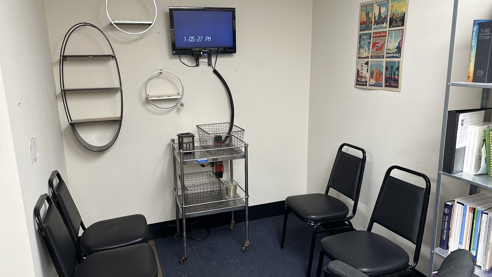 Interior room with decorative table display featuring meditation figure, recovery-focused books, and promotional materials