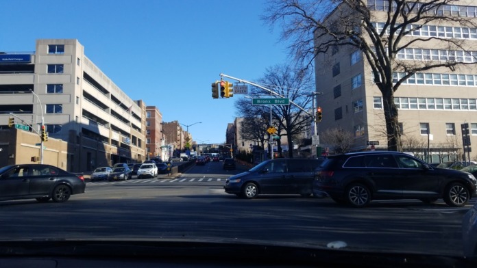 Exterior street view showing medical center building among surrounding urban architecture and traffic intersection