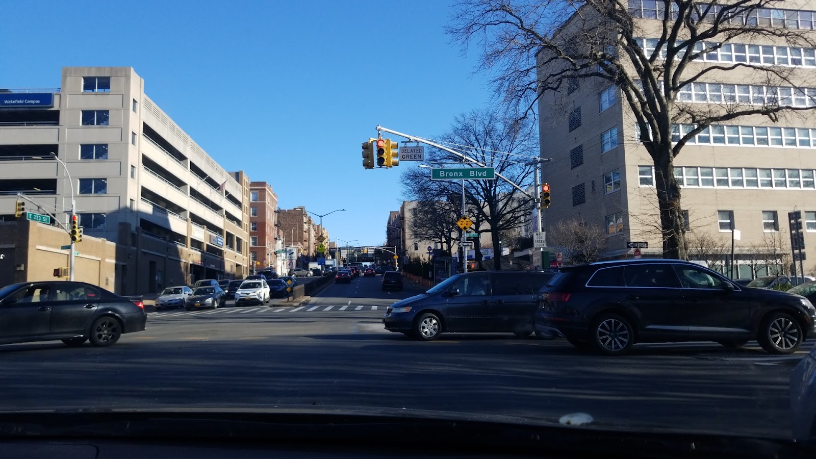 Exterior street view showing medical center building among surrounding urban architecture and traffic intersection