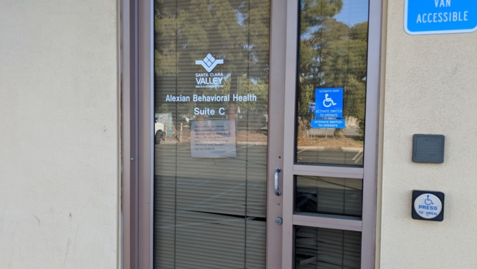 Entrance door to Alexian Behavioral Health Suite C with accessible wheelchair signage and entry controls.