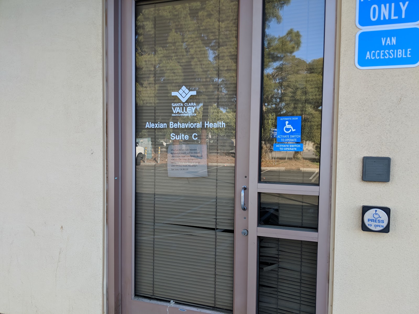 Entrance door to Alexian Behavioral Health Suite C with accessible wheelchair signage and entry controls.