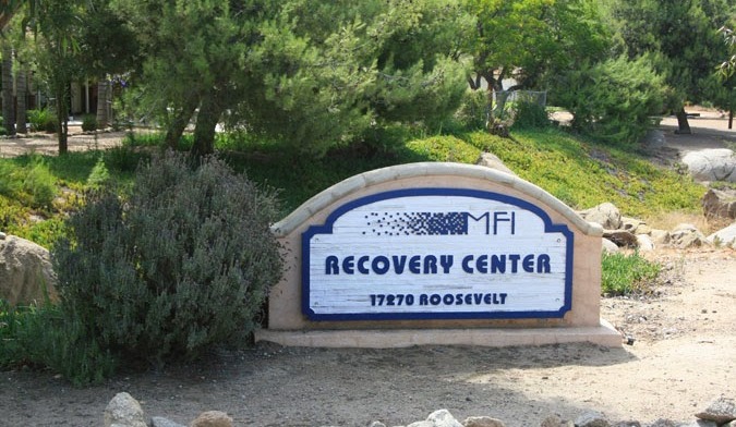 Ground-level signage for MFI Recovery Center at 17270 Roosevelt Street address